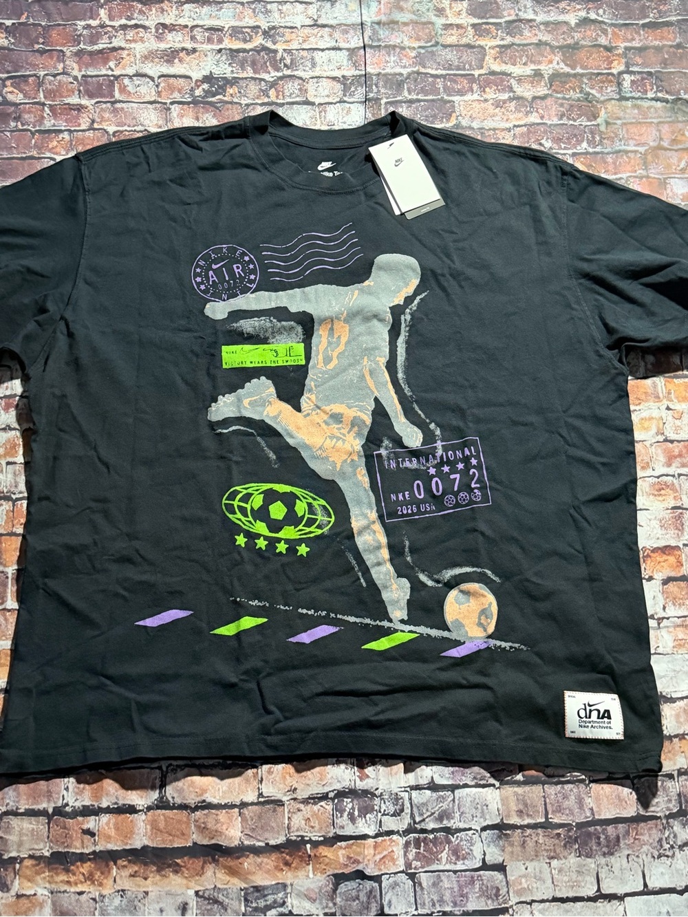Nike Black Short-Sleeve Graphic Soccer Tee with Neon Accents